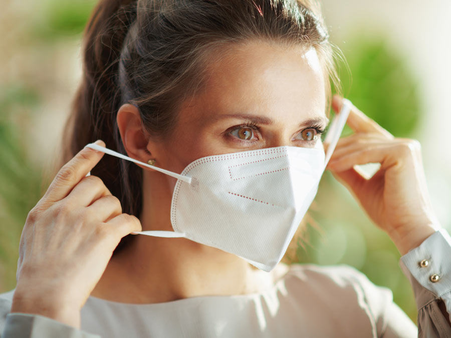 Woman wearing mask.